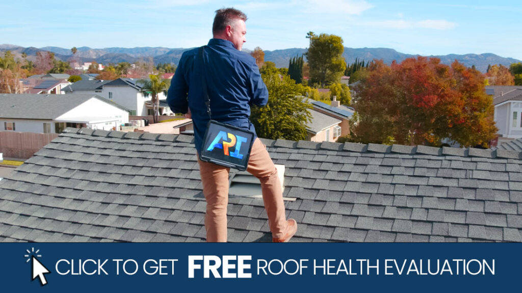 Technician performing a professional roof health evaluation on a Southern California home