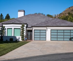 Single-story Southern California home with dark shingle roof installed using roofing and solar financing options