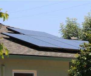 Solar panels repositioned and secured during professional solar system repair service