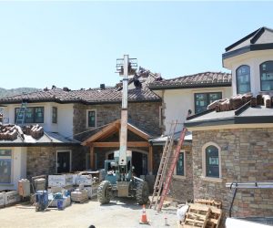 Roof installation underway on a Southern California home by August Roofing & Solar